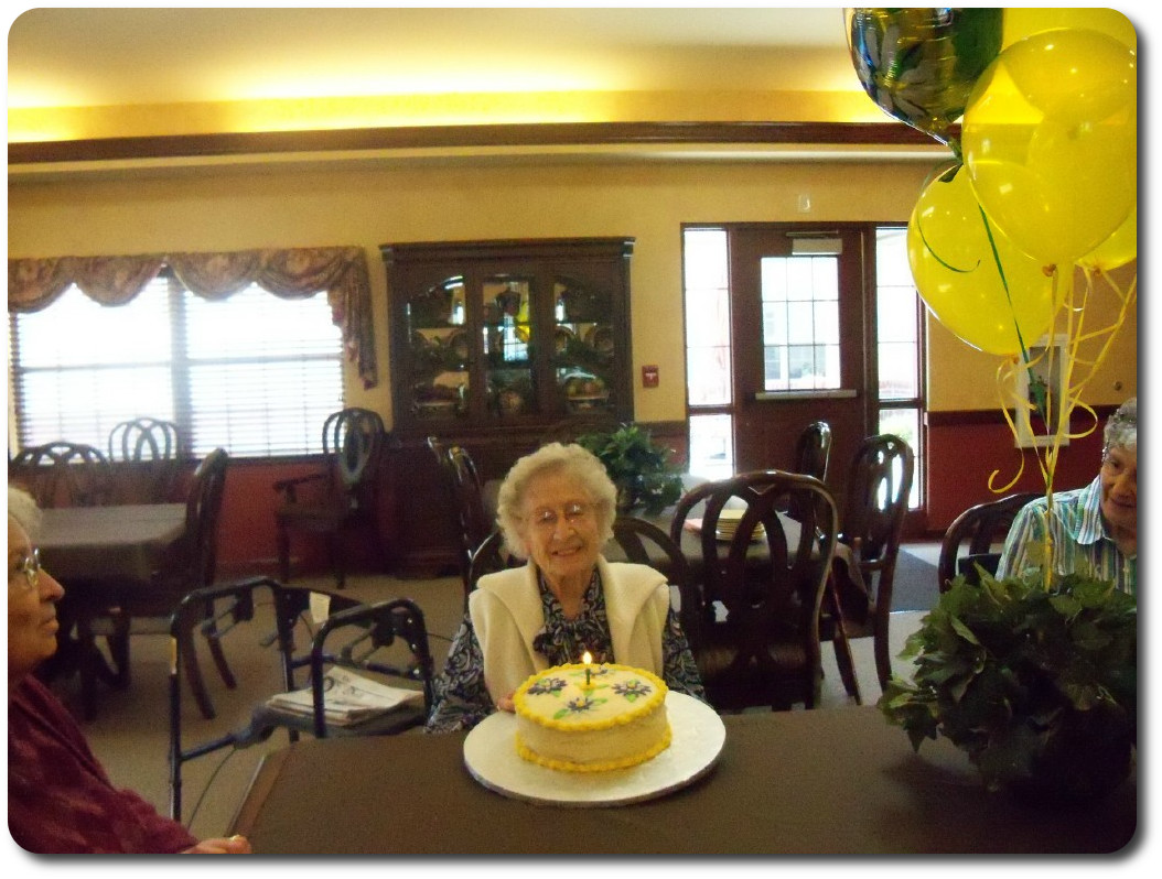 Resident enjoying birthday cake at our monthly birthday party.