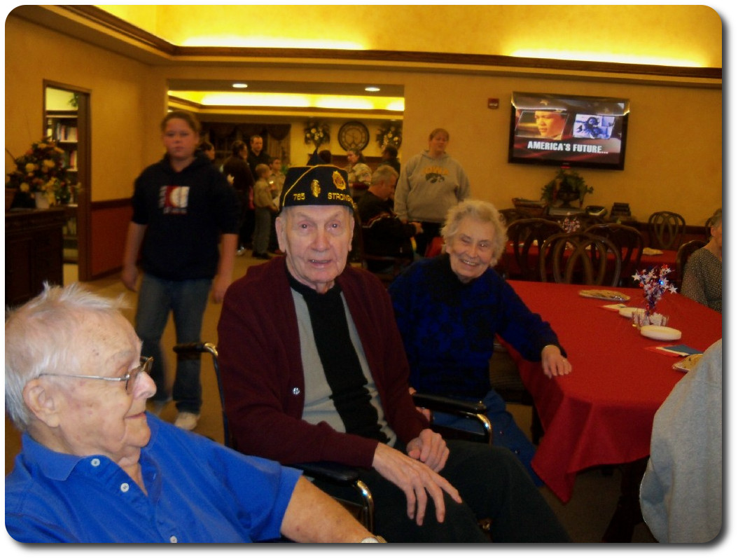 Residents and family enjoying Veteran's day party, honoring our Veterans.