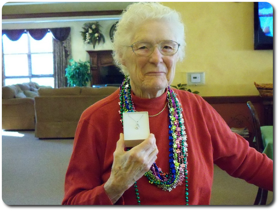 Resident showing her gift she won at Bingo.