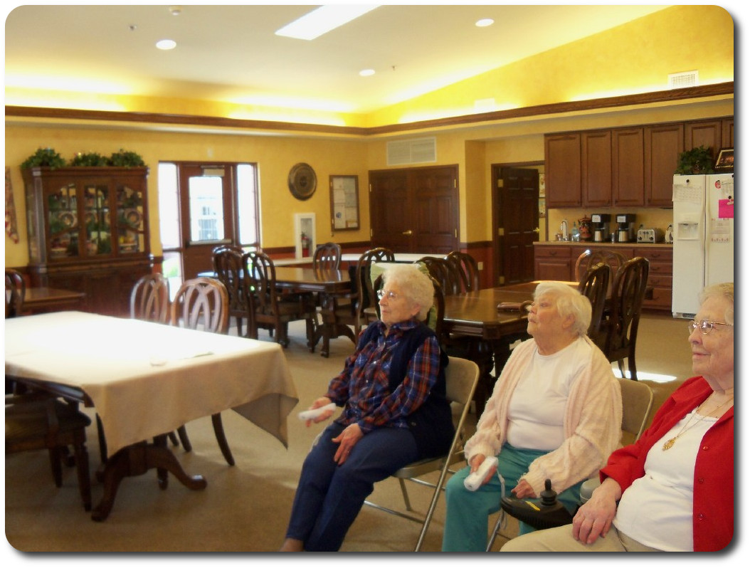 Residents playing WII bowling.